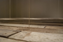 Detail of thread attached to floor